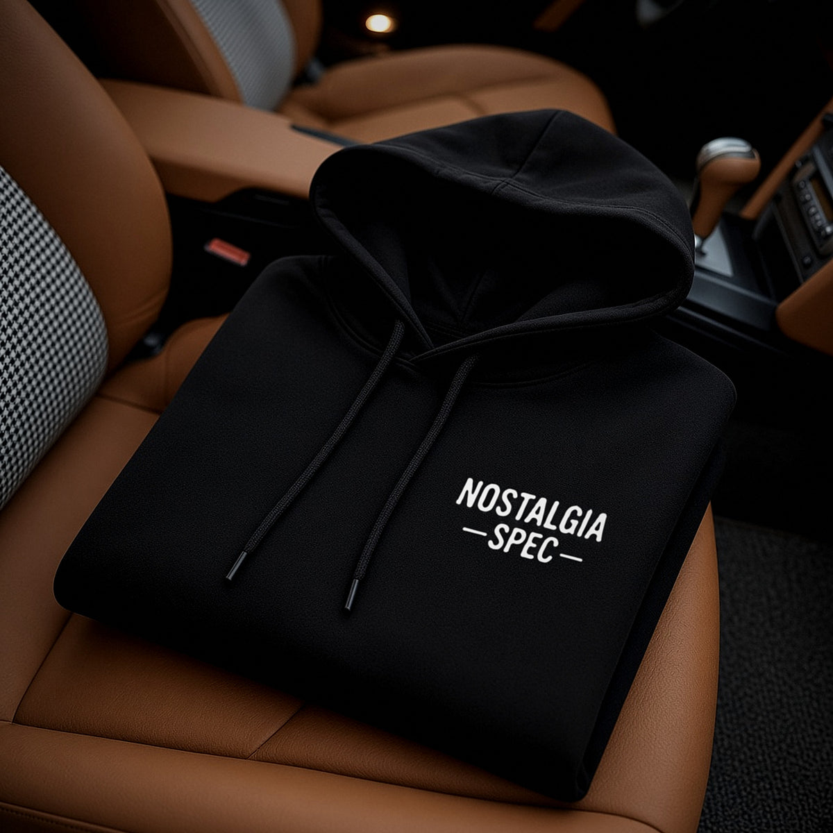 Nostalgia Spec Classic Hoodie folded on a Porsche 911 seat