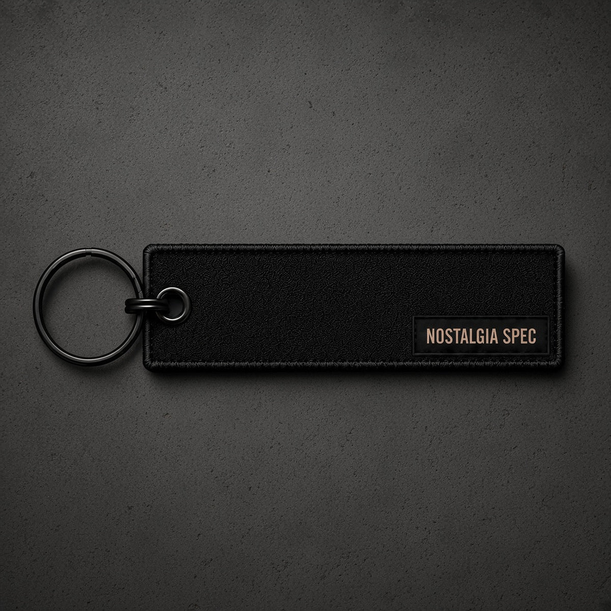Nostalgia Spec Dealer Keychain, black, overhead product photo