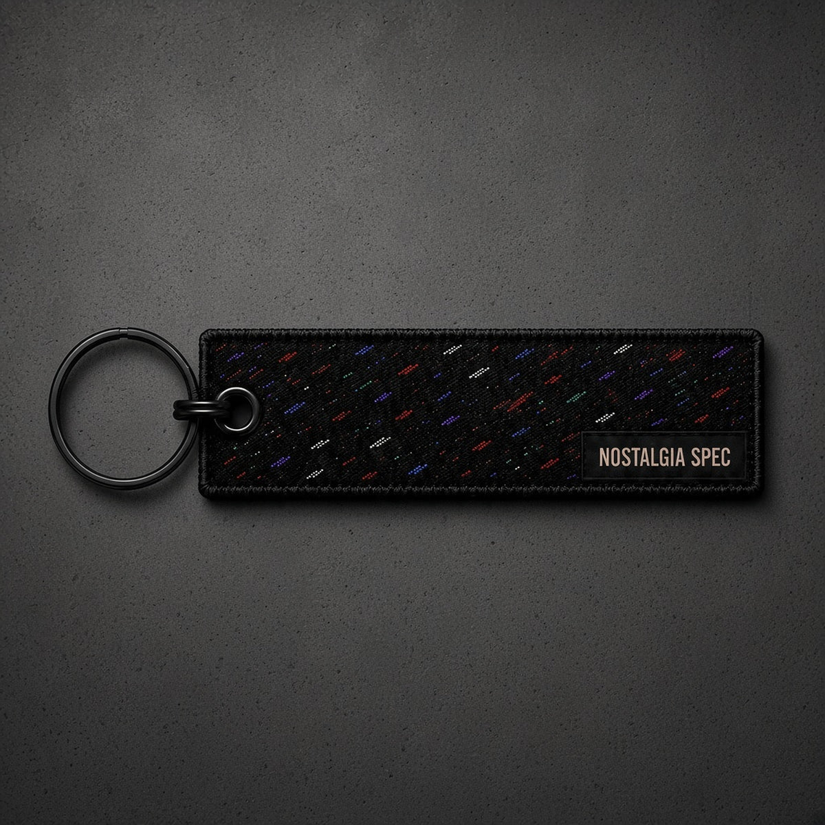 Nostalgia Spec Dealer Keychain, confetti, overhead product photo