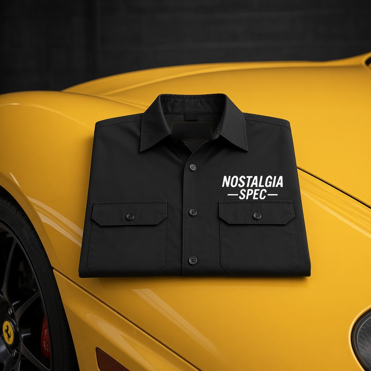 Nostalgia Spec Mechanics Shirt folded on a yellow Ferrari 360 hood