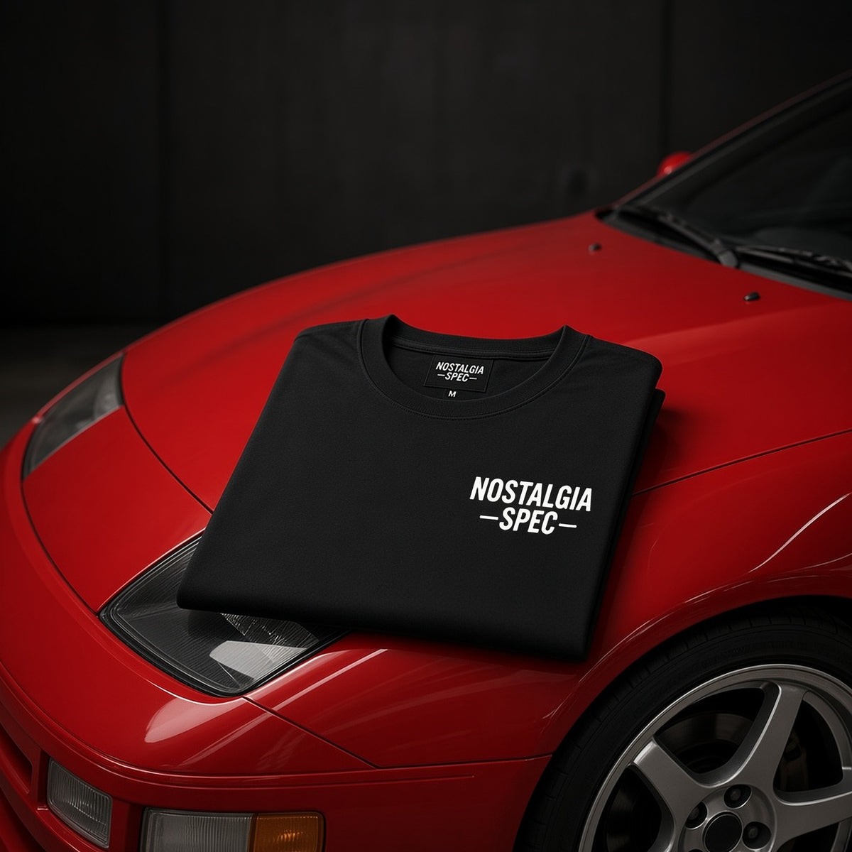 Nostalgia Spec Classic T-Shirt folded on a red Nissan 300ZX hood